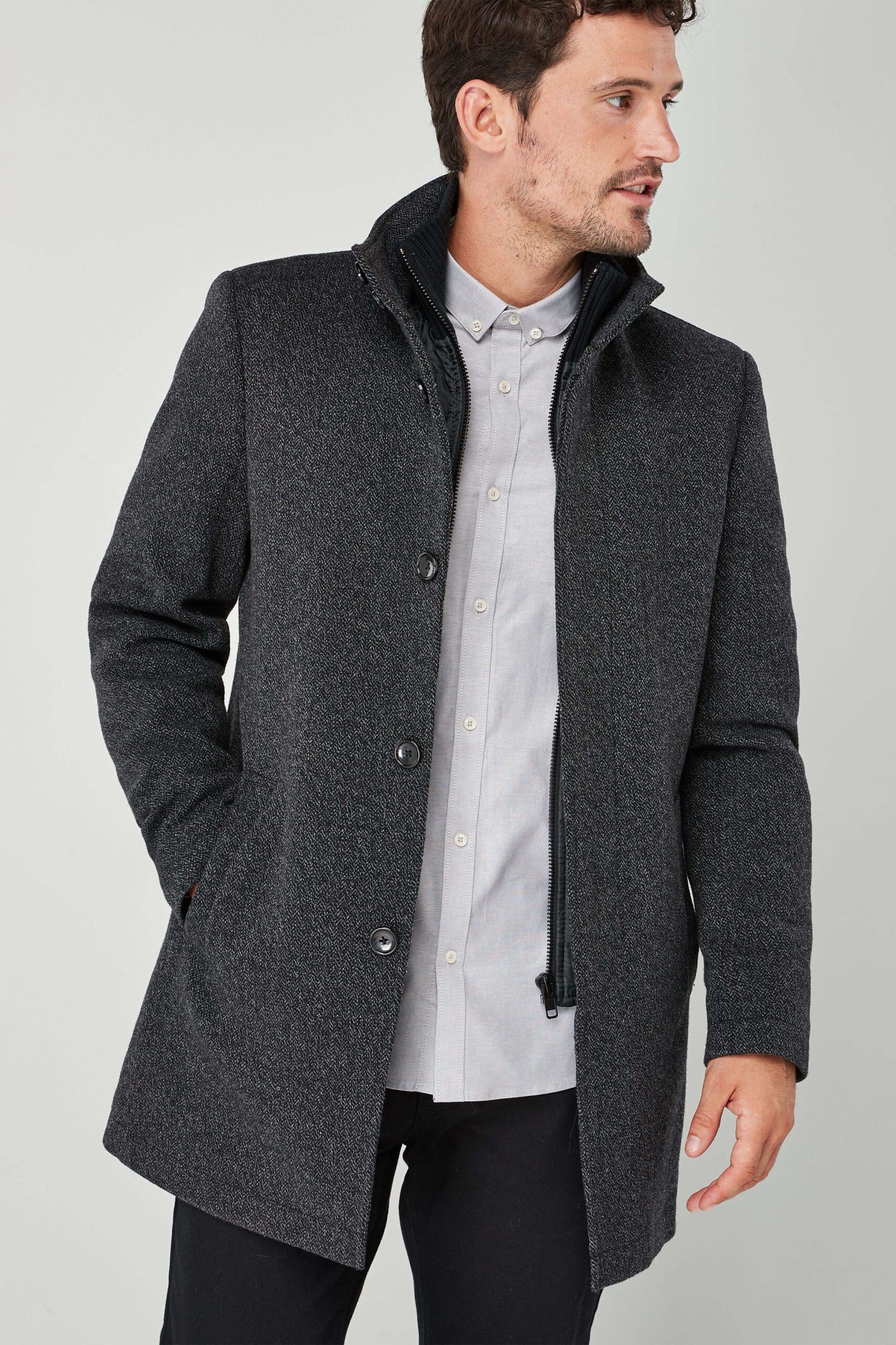 Stylish and sophisticated - a tailored wool coat and leather jacket for the modern man.