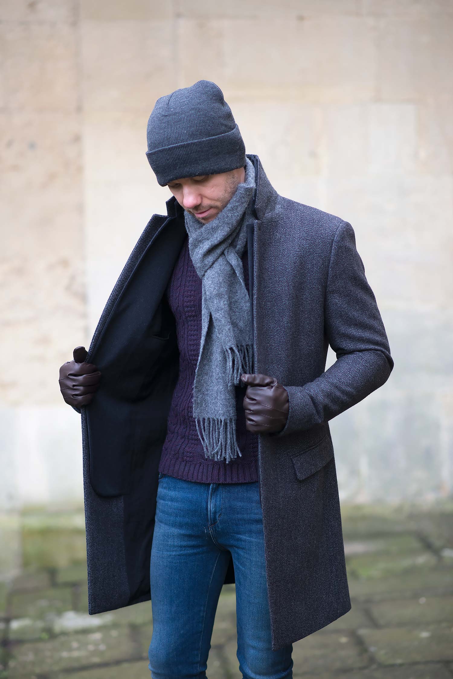 Stylish and sophisticated - a grey, tailored overcoat paired with a classic black jacket.