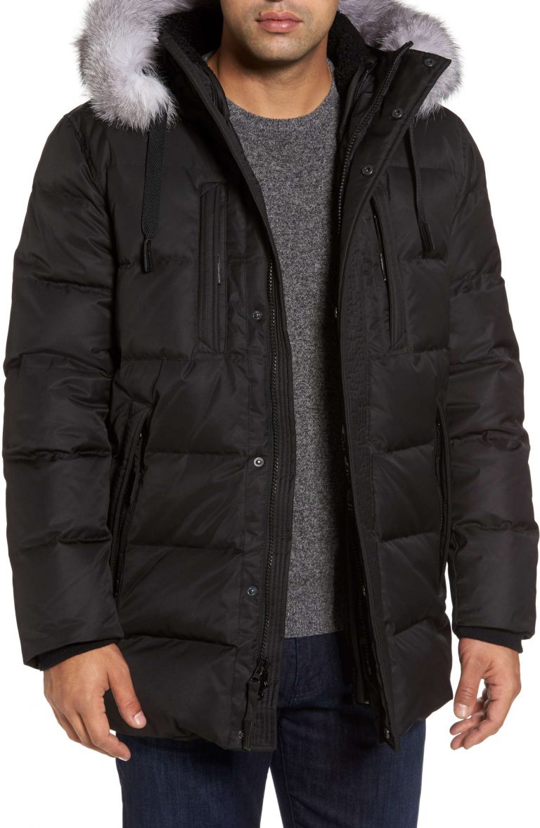 Andrew Marc quilted down winter jacket with luxurious fox fur trim in sleek black.