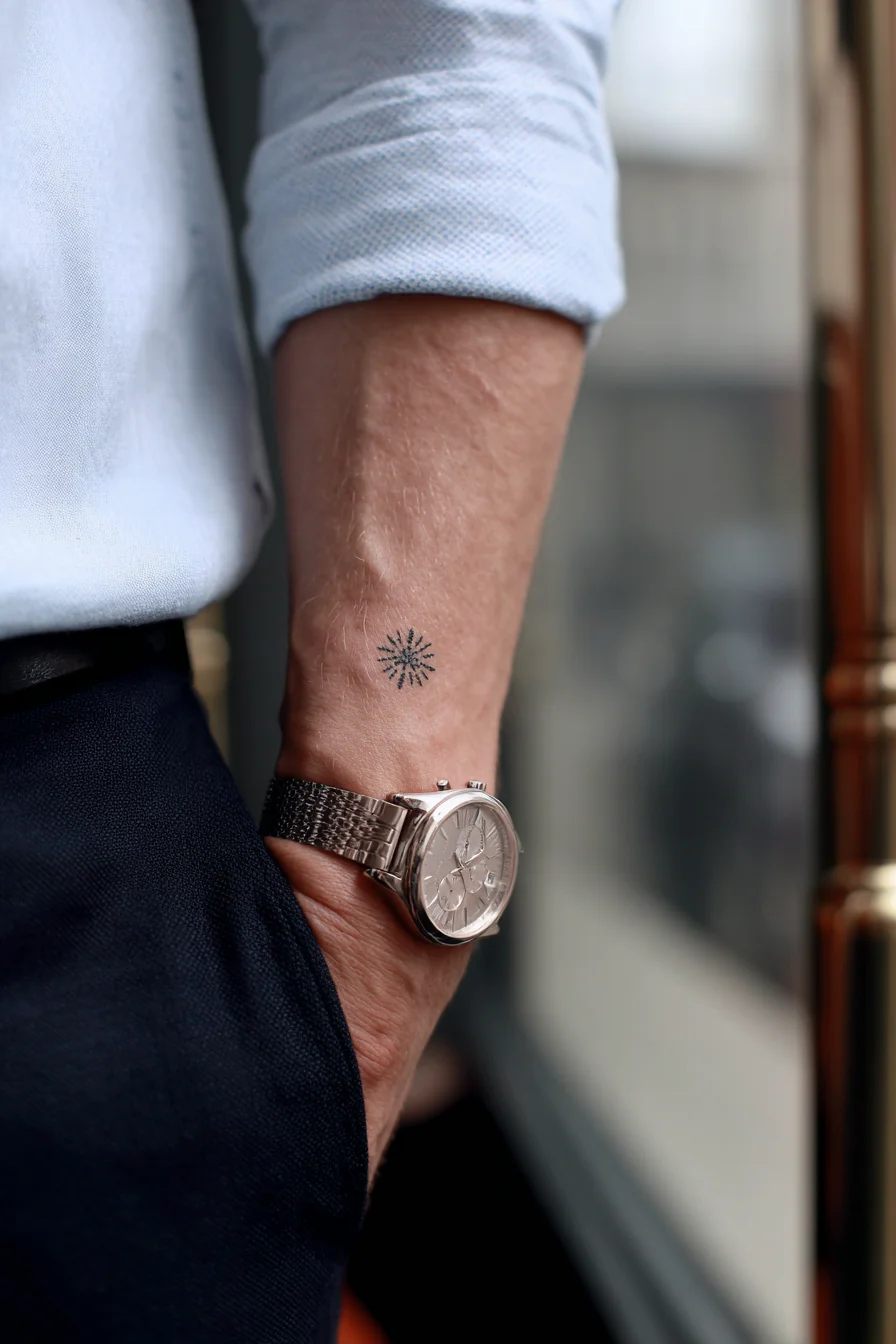 Minimal Sunburst / Compass Inner Wrist Tattoo — Small Masculine Wrist Design