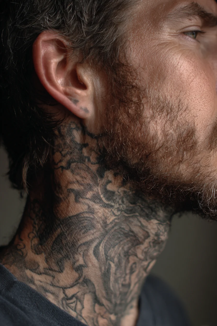 Black-and-Grey Neck Tattoo — Full-Wrap Ornamental Waves