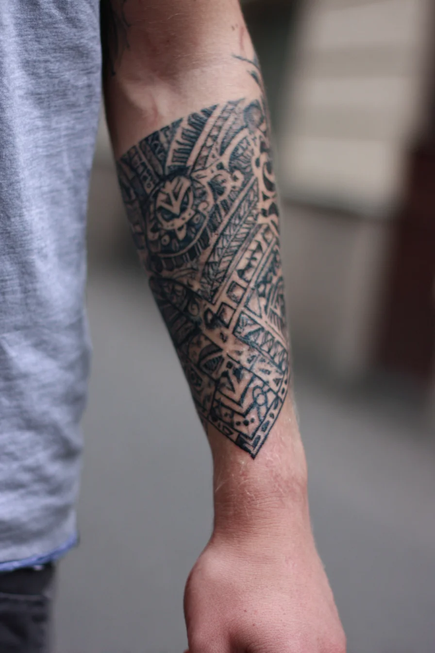 Polynesian Tribal Geometric Forearm Tattoo — Blackwork Sleeve Accent